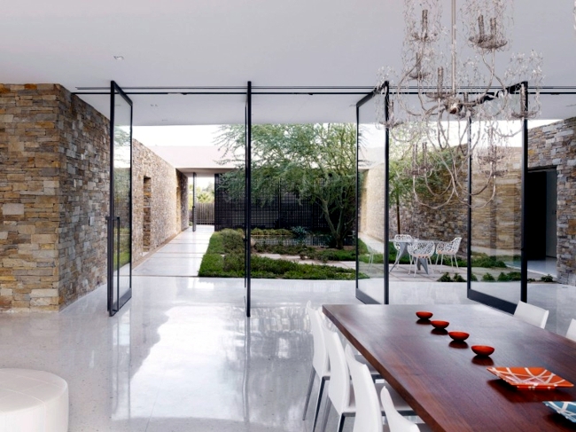Stone and glass opens to the landscape