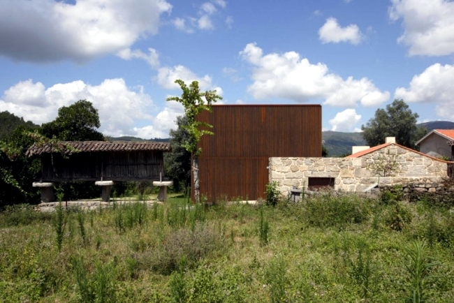 A modern house is located in an old farm