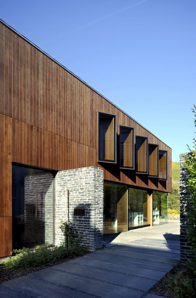 An energy efficient home dressed in solid wood and stone