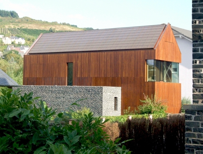 An energy efficient home dressed in solid wood and stone