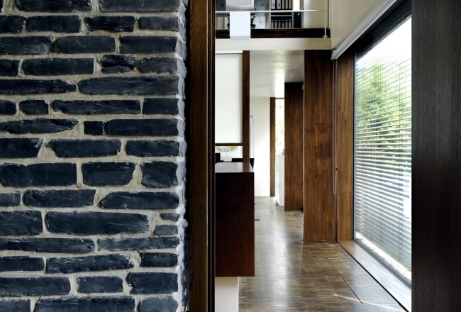 An energy efficient home dressed in solid wood and stone