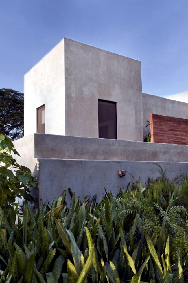 Modern colonial residence built with concrete walls ruins