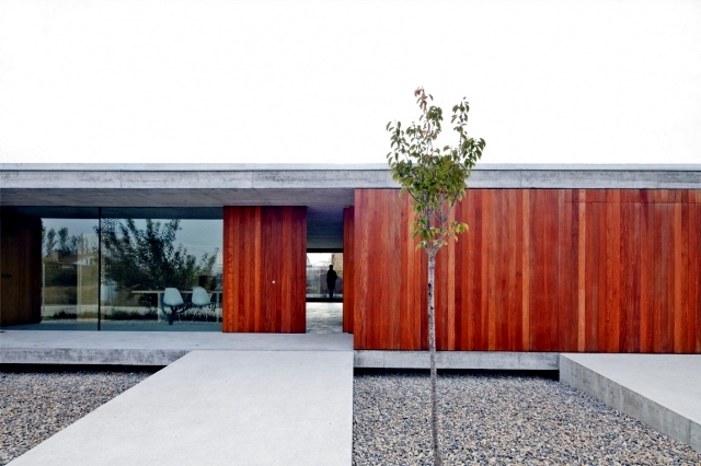 One storey, flat roof of minimalist concrete and wood