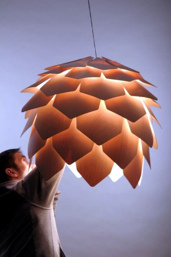 Wood Design Chandelier suspended exciting resembles a pine cone