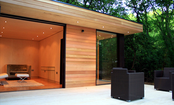 Prefabricated Wood and Glass House in the forest