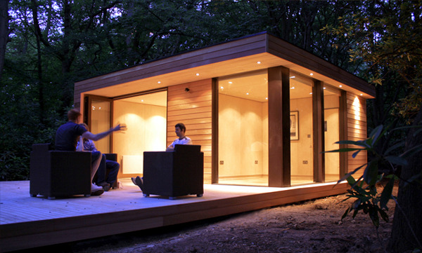 Prefabricated Wood and Glass House in the forest