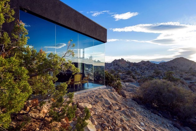 A black modern home in the California desert