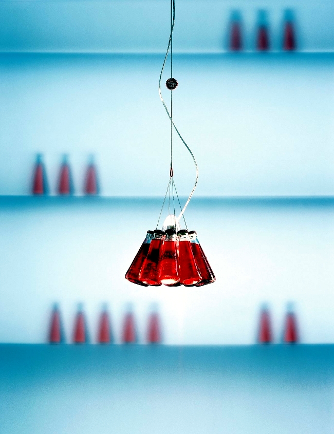 Designer table lamp Ingo Maurer Campari Bar produces light reflections