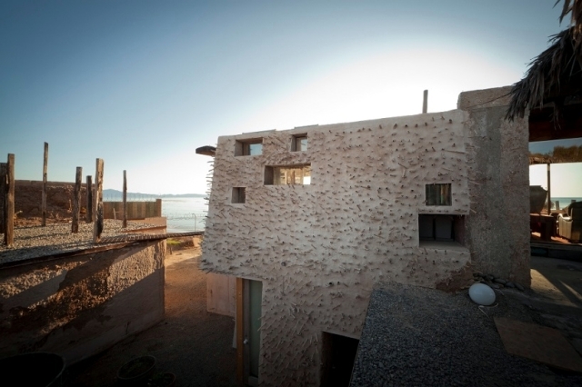 You built beach house by the sea and mostly made of recycled materials
