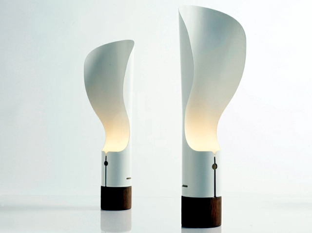 Contemporary table lamp rotates about the axis and the soft light and diffuse