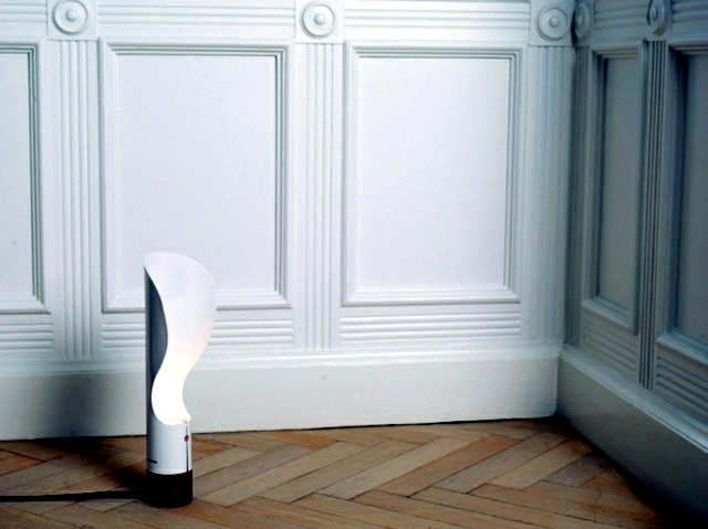 Contemporary table lamp rotates about the axis and the soft light and diffuse