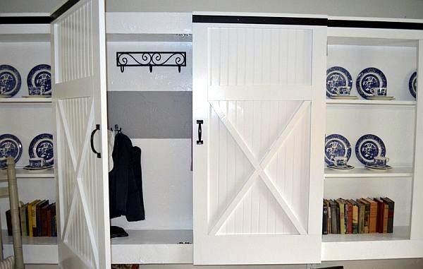 Wooden sliding door give the interior a rustic touch
