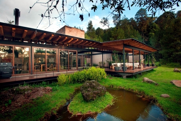 Flat roof modern wooden house in the middle of a forest of Mexico