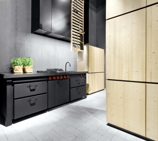 Modern fitted kitchen with cooking island brings home Italian style