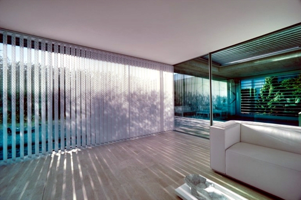 Blinds and shutters adorn the windows and provide privacy