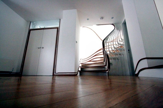 Amazing "floating" wooden staircase - designed by Atmos Studio