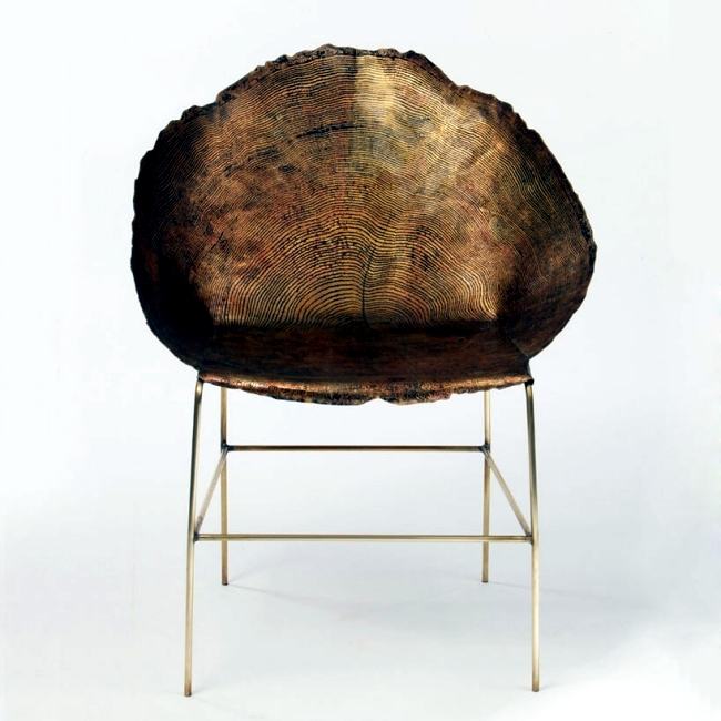 Designer chairs made of metal but with a fine grain tree trunk
