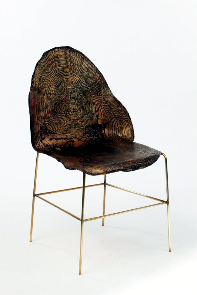 Designer chairs made of metal but with a fine grain tree trunk