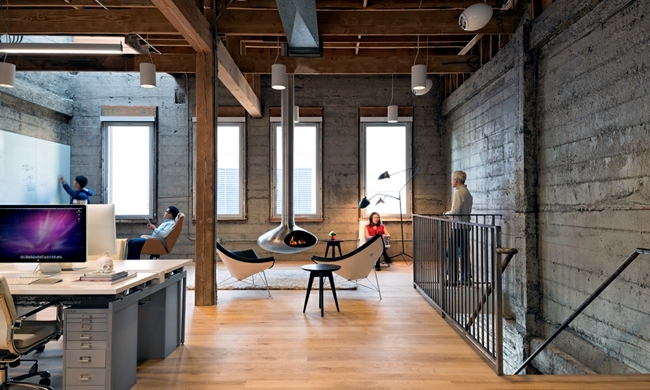 Eclectic office equipment - concrete and wood dominate the interior
