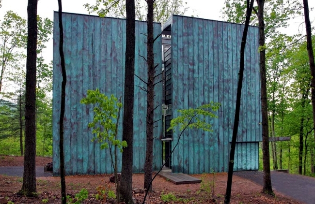 Eco house in the forest convinced by cladding with copper