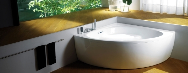 Ergonomic corner bath with shower and whirlpool function by Teuco