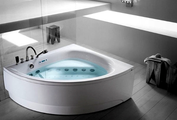 Ergonomic corner bath with shower and whirlpool function by Teuco