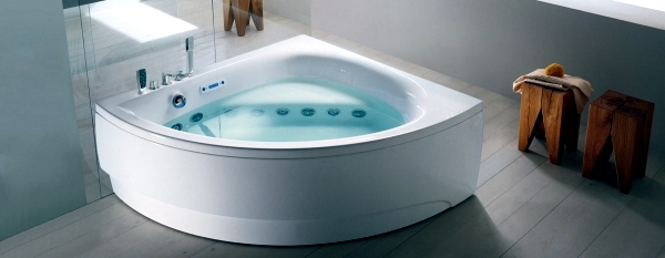 Ergonomic corner bath with shower and whirlpool function by Teuco