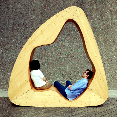 Furniture for relaxation - A wooden triangle as chair, bed and chair