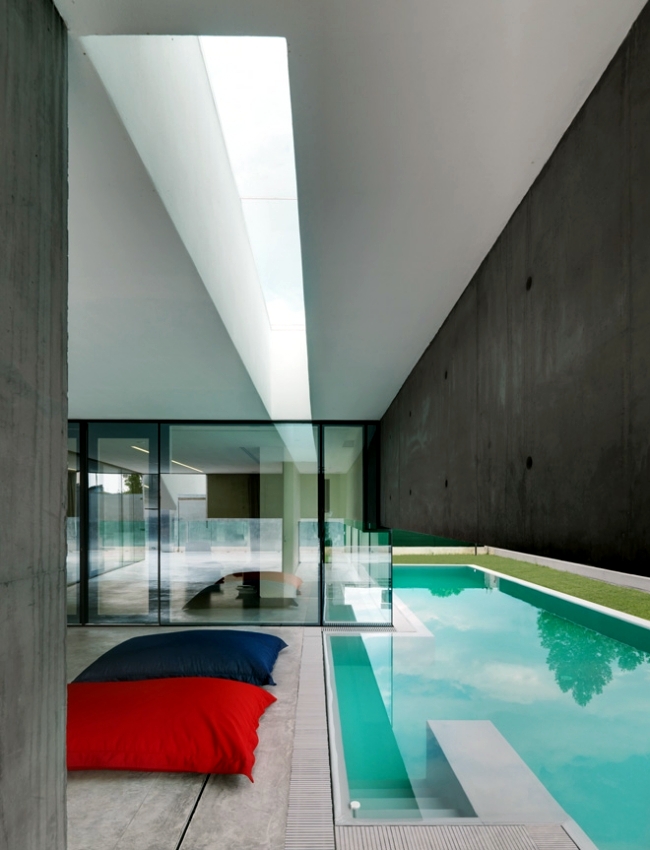 Idyllic concrete house with pool provides safety and privacy