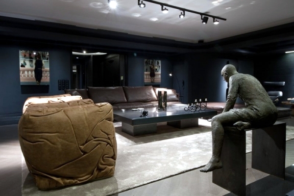 Leather furniture and works of art characterize a luxury apartment in Athens