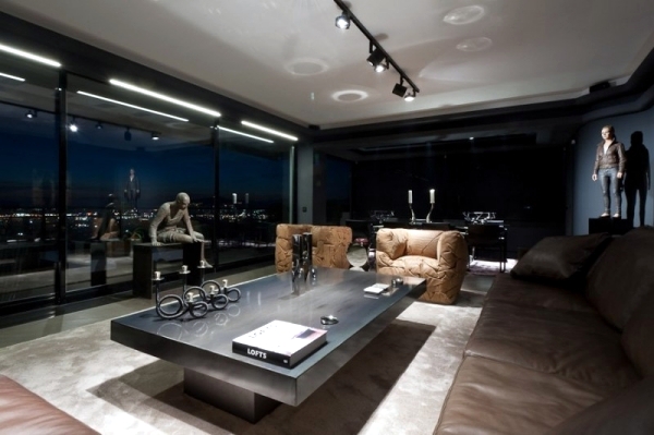 Leather furniture and works of art characterize a luxury apartment in Athens