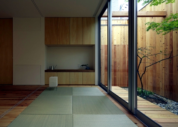 Minimalist Wooden house with a courtyard in the middle of the big city