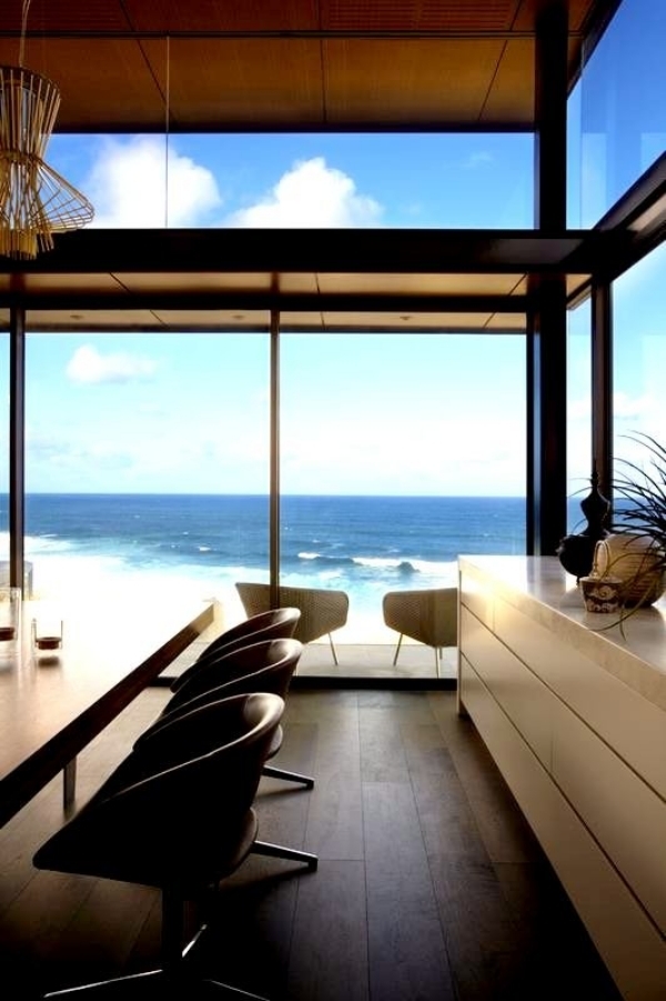Modern beach house with glass front and a wonderful sea view