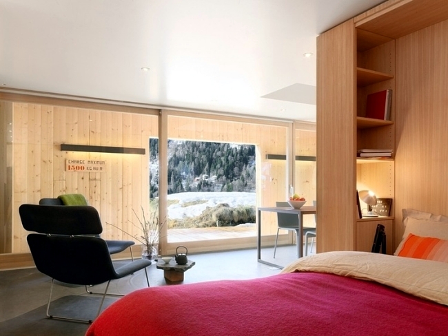 Modern log cabin in Switzerland was once old military building