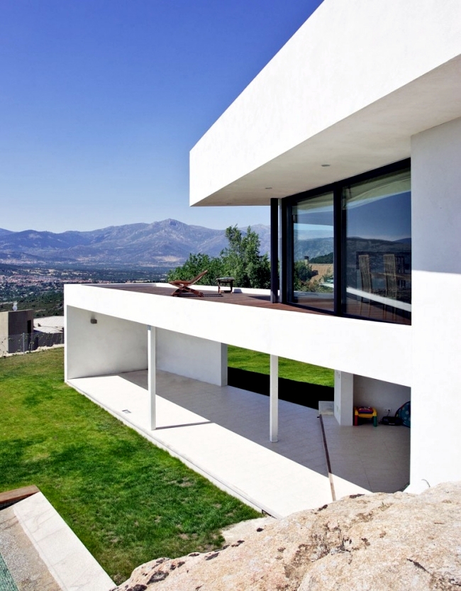 Modern villa on marble stone foundation blends with the environment