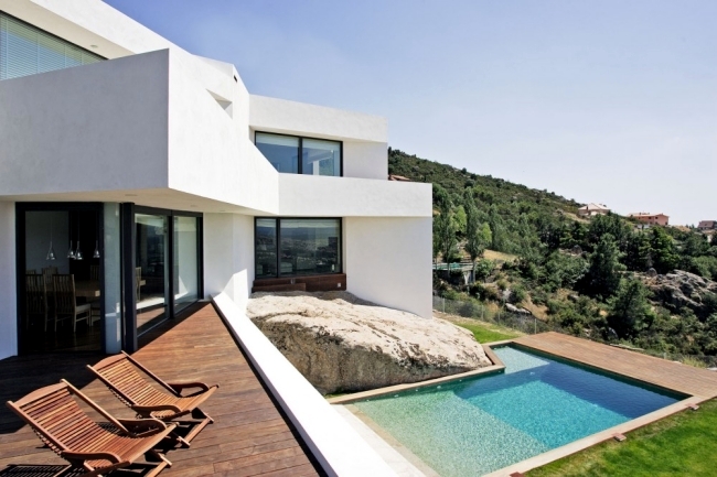 Modern villa on marble stone foundation blends with the environment