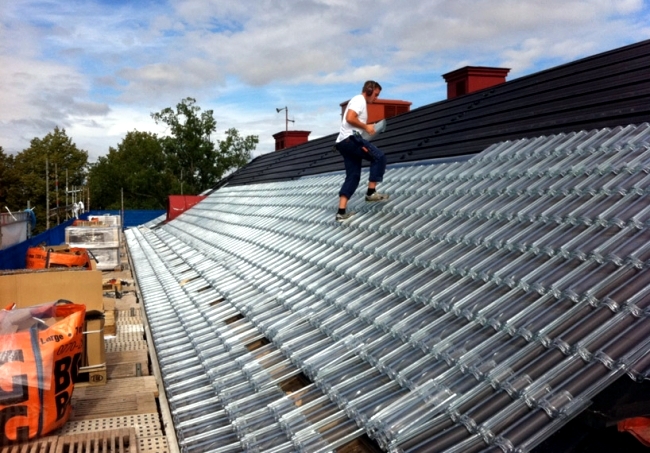 Produced tiles of glass as an effective roof system, the power