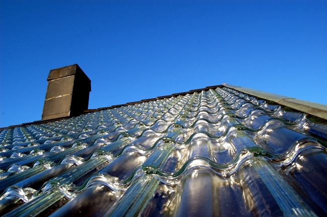 Produced tiles of glass as an effective roof system, the power