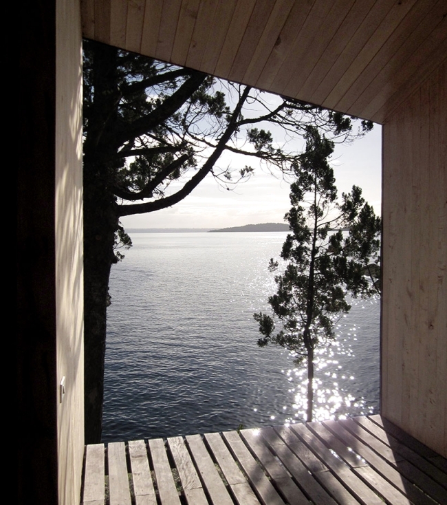 Simple design wooden sauna with breathtaking sea view