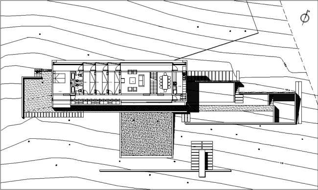 The coach house on a hillside impressed with massive concrete structure